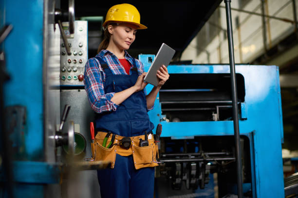 istock Female Technician Working at Factory 856865420
