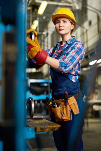istock Young Woman Operating Machines in  Factory Workshop 856865434