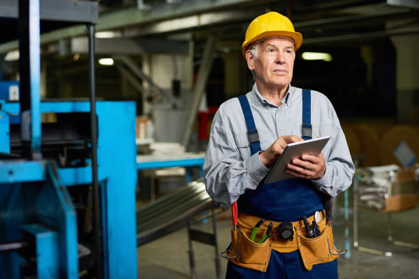 istock Senior Man  at Modern Factory 856865504