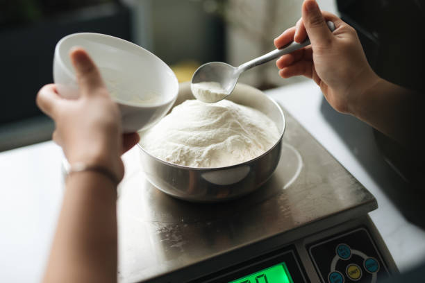 istock Bakery chef weighing flour on the digital scale 856868884