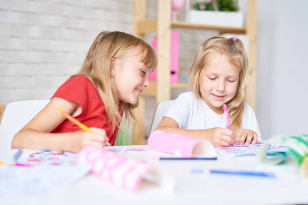 istock Little Girls Drawing Together 856876510