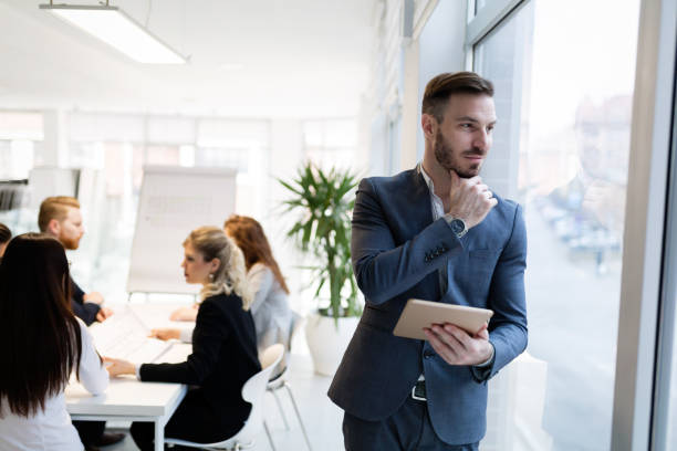 istock Portrait of young handsome architect on meeting 856876626