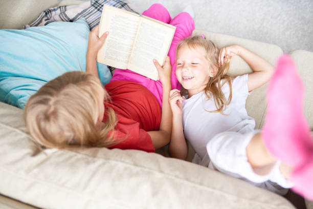 istock Sisters Reading Fairytales 856876650