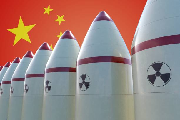 istock Nuclear missiles and Chinese flag in background. 3D rendered illustration. 856882478