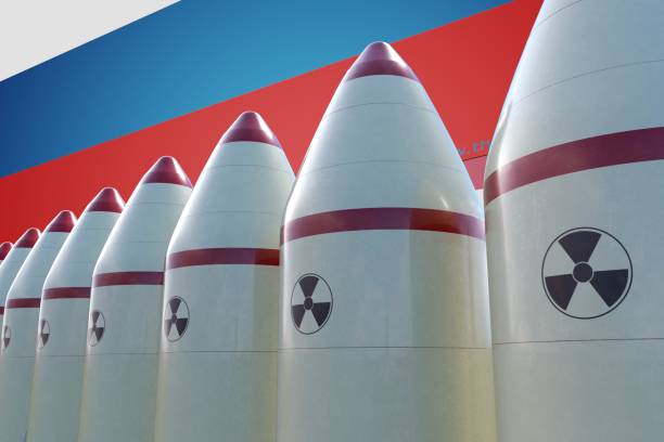 nuclear missiles and russian flag in background. 3d rendered illustration. - cold war imagens e fotografias de stock