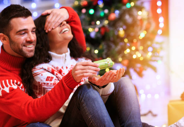 istock Couple having fun at home for Christmas 856888120
