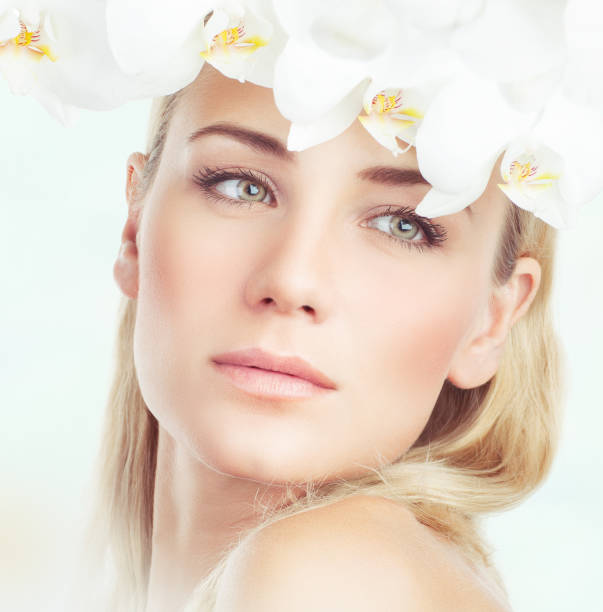 istock Beautiful woman in flowers 856889136
