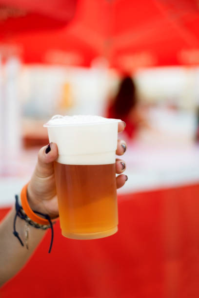 istock Woman holding beer 856892930
