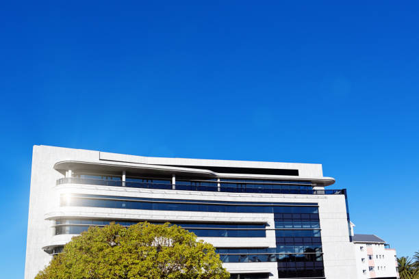 istock Exterior of modern office building in bright sunlight 856892974