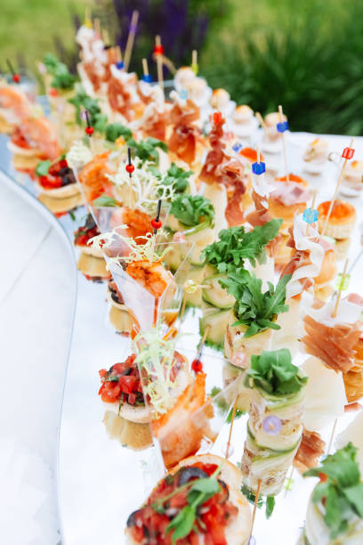istock Beautifully decorated catering banquet table with different food snacks and appetizers 856893918