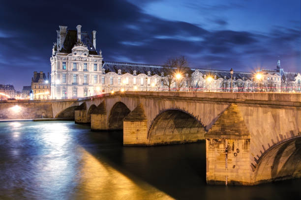 Louvre Museum and Pont des arts, Paris - France Louvre Museum and Pont des arts, Paris - France musee du louvre stock pictures, royalty-free photos & images