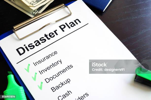Disaster Plan On A Table Stock Photo - Download Image Now - Emergency Planning, Accidents and Disasters, Document