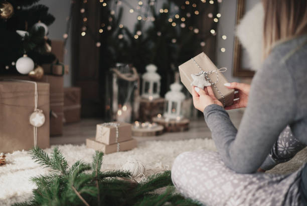istock Woman watching handmade a christmas presents 856901824