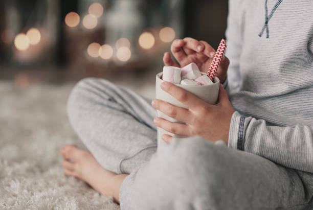 Boy in pajamas drinking hot chocolate