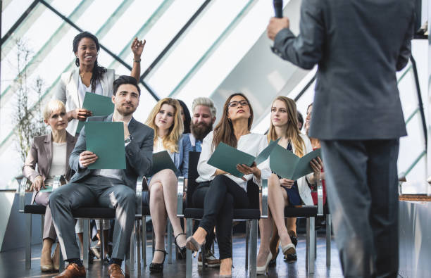 istock Business People on Conference Event Asking Questions 856916438