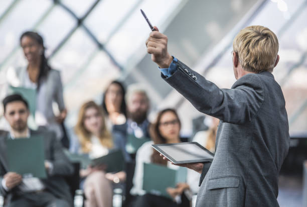 istock Business People on Conference Listening to Speaker 856916526