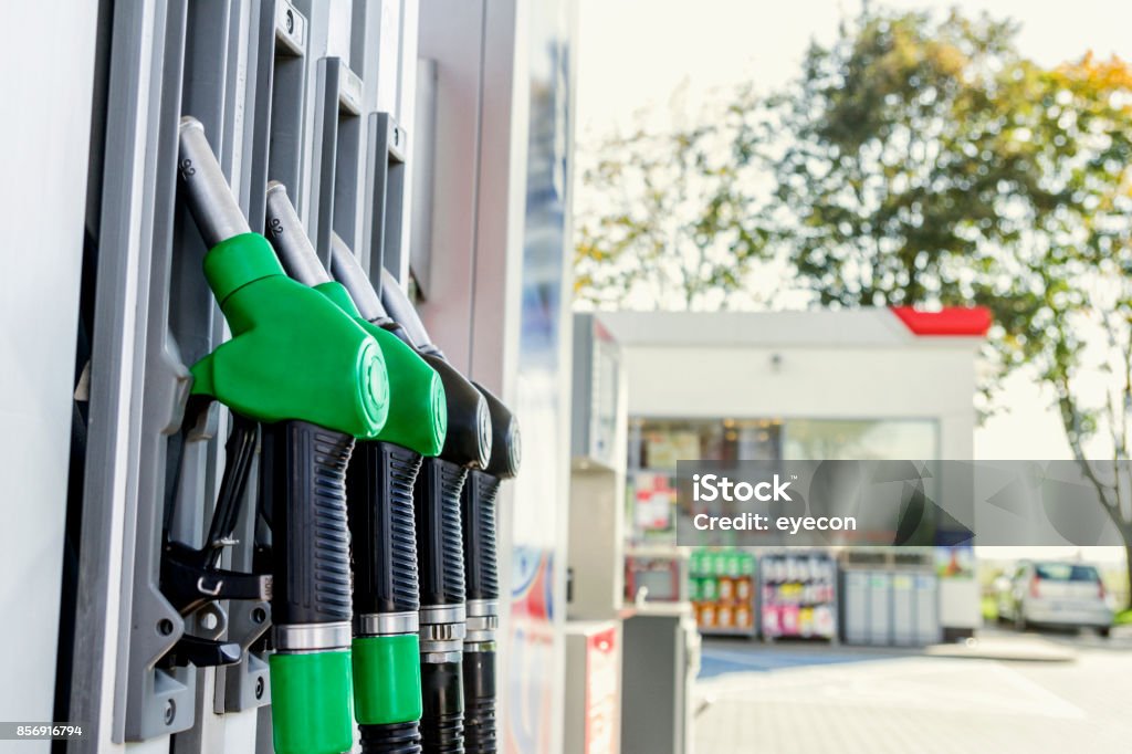 Gasoline and diesel distributor at the gas station Gasoline and diesel distributor at the gas station. Gas pump nozzles. Delivering Stock Photo