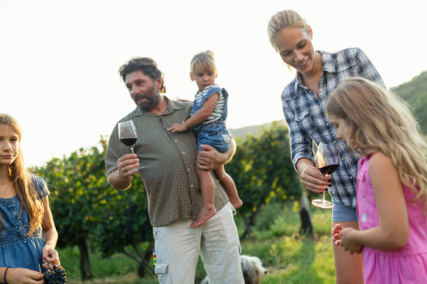 istock Winemaker family together in vineyard 856917428