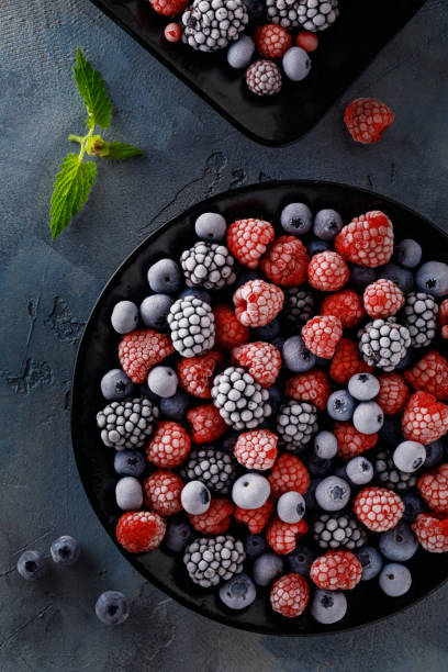 Frozen juicy and ripe berries of blueberries, blackberries and raspberries, top view stock photo