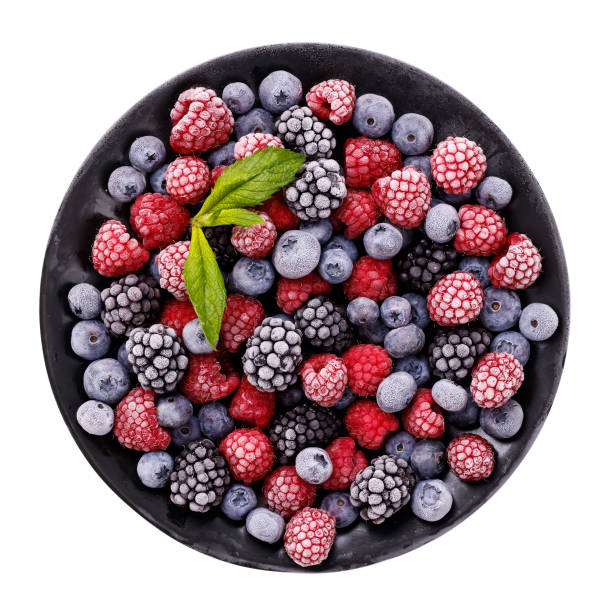 istock Frozen juicy and ripe berries in a black plate isolated on white background 856919782