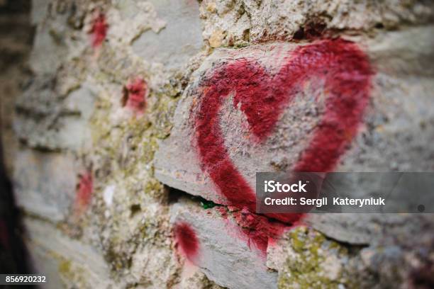 Close Up Background Graffiti Silhouette Of Red Heart On An Old Relief Stone Wall Stock Photo - Download Image Now