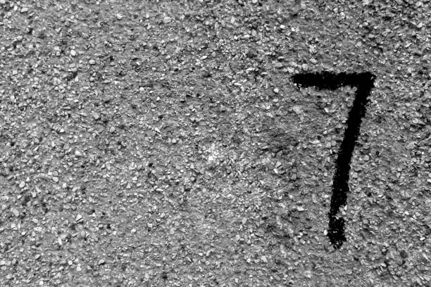 istock Number seven on grungy cement wall. 856921002