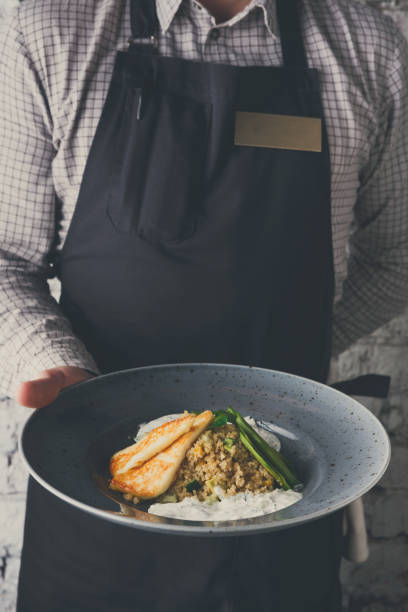 istock Waiter offering delicious restaurant dish 856924464