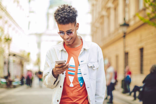 istock Young man using phone in the city 856927902