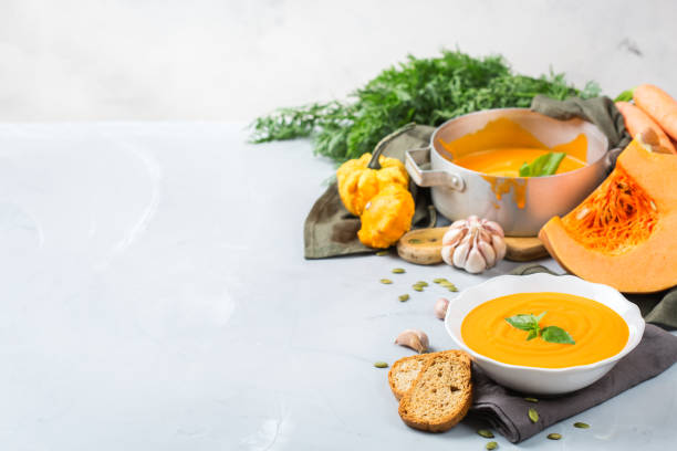 istock Fall autumn roasted orange pumpkin carrot soup with garlic 856939112