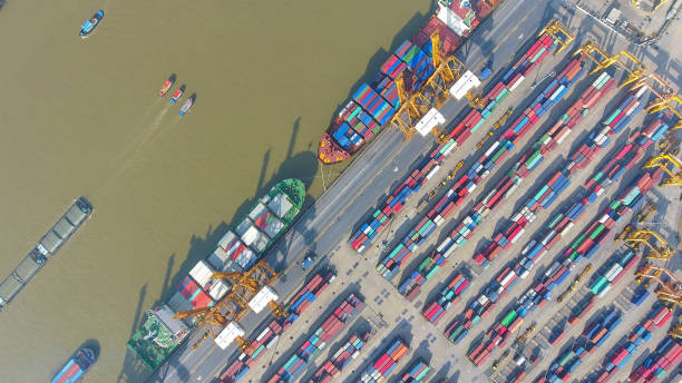 istock aerial view container harbor with crane, top view 856939528