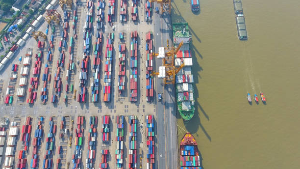istock Logistics and transportation of Container Cargo ship and Cargo working crane bridge in shipyard 856939930