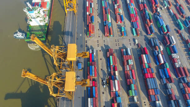 istock Logistics and transportation of Container Cargo ship and Cargo working crane bridge in shipyard 856939932