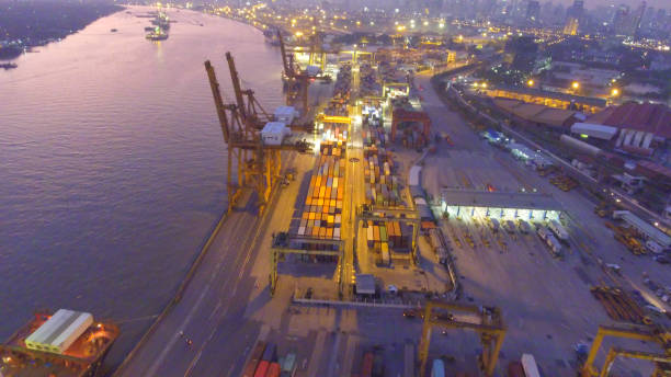 istock Logistics and transportation of Container Cargo ship and Cargo working crane bridge in shipyard 856939956