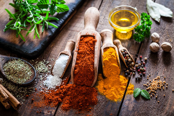 istock Flavoring: Spices and herbs on rustic wooden table 856943226