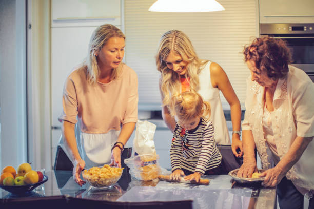 家族のポートレート - grandmother pie cooking baking ストックフォトと画像