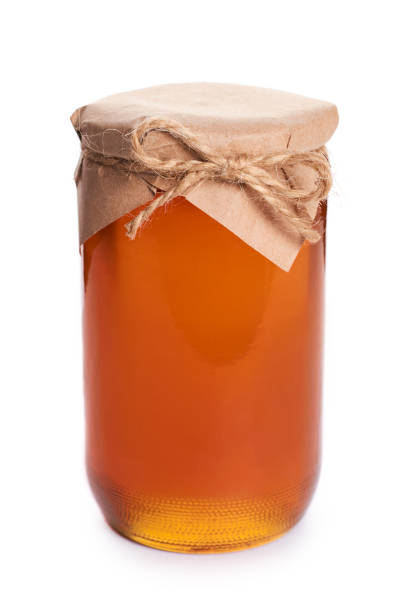 istock eco home made honey in jar isolated on white background 856947770
