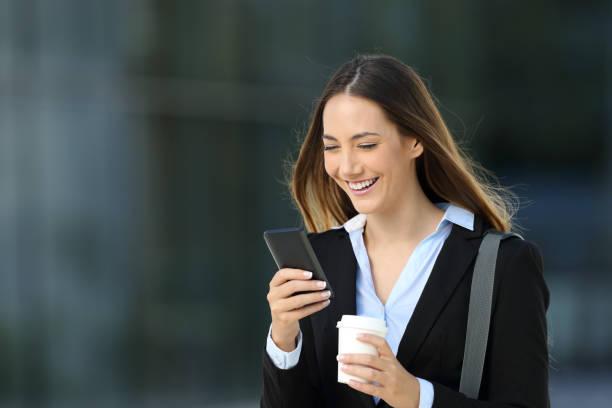 istock Executive checking content in a smart phone on the street 856948864