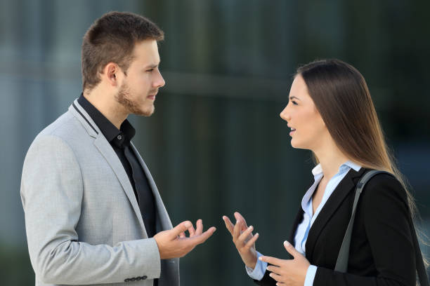 istock Two executives talking seriously on the street 856949192