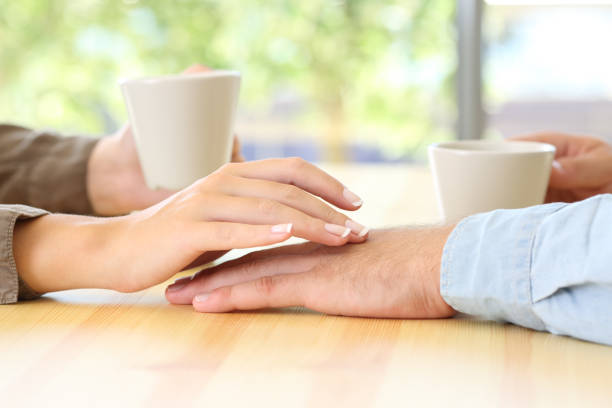 istock Couple dating and touching hands 856949240