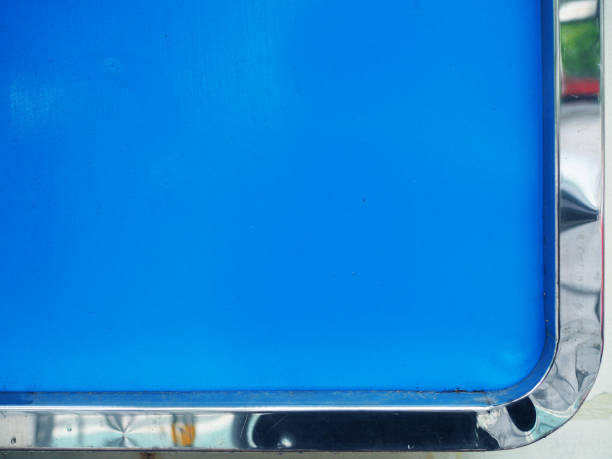 istock Blue painted board with shiny silver round border corner 856949398