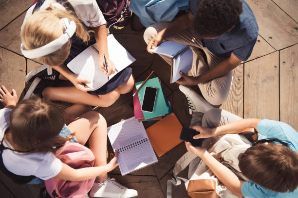 istock multiethnic teenagers studying together 856952964