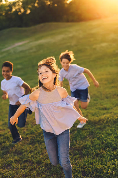 istock multiethnic teens running in park 856966102