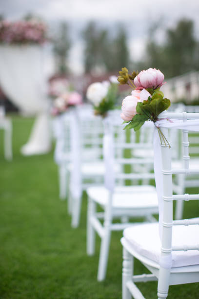 istock Outdoors wedding decoration with flower bouquets, candles and garlands 856968836