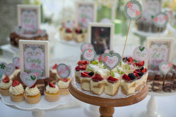 istock Small white and green cakes at a wedding candy bar 856969108