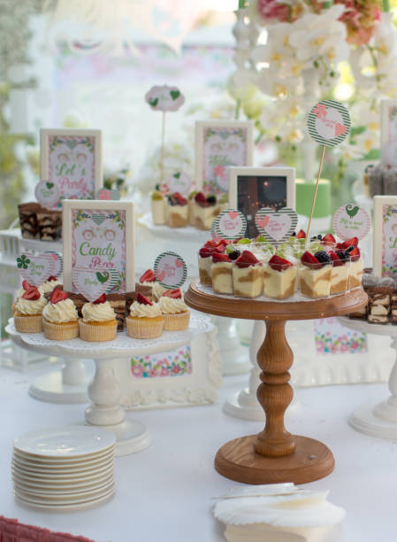 istock Small white and green cakes at a wedding candy bar 856969120