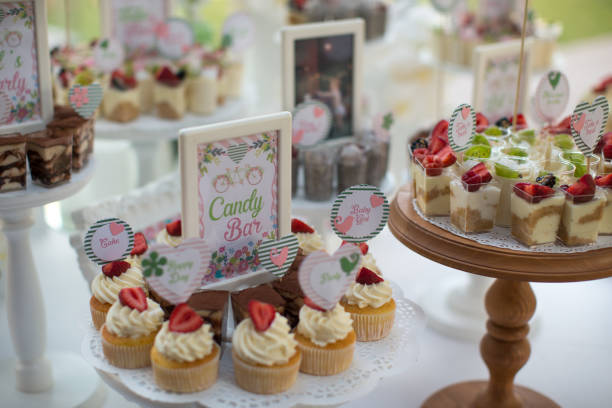 istock Small white and green cakes at a wedding candy bar 856969136