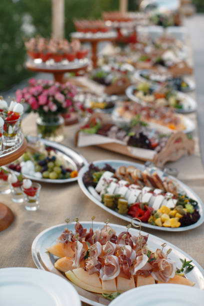 istock Outdoors fourchette table with italian appetizers and fresh flowers 856969782