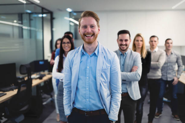 istock Successful team of young perspective businesspeople in office 856979202