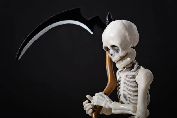 istock The death holding scythe 856979266