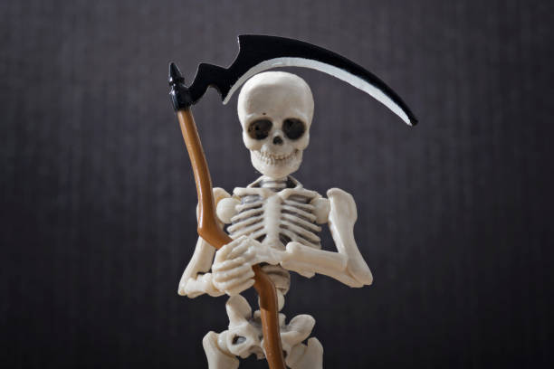 istock The death holding scythe 856979284